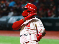 Jose Pirela #67 of Diablos Rojos breaks the bat after hitting the ball against Sultanes de Monterrey during match 2 between Sultanes de Mont...