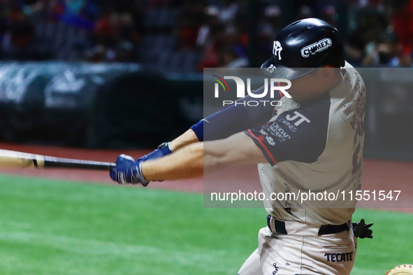 Victor Mendoza #25 of Sultanes de Monterrey hits the ball against Diablos Rojos during match 2 between Sultanes de Monterrey and Diablos Roj...