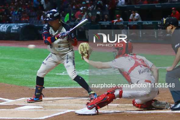 Ramiro Pena #19 of Sultanes de Monterrey hits the ball against Diablos Rojos during match 2 between Sultanes de Monterrey and Diablos Rojos...