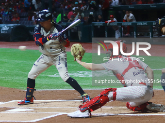 Ramiro Pena #19 of Sultanes de Monterrey hits the ball against Diablos Rojos during match 2 between Sultanes de Monterrey and Diablos Rojos...