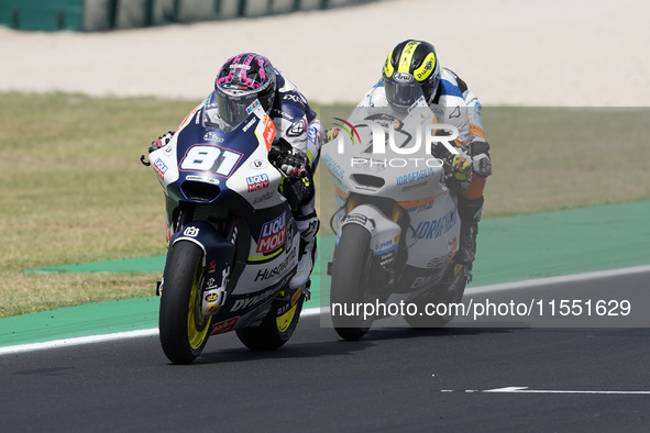 Senna Agius of Australia and Liqui Moly Husqvarna Intact GP rides on track in front of Barry Baltus of Belgium and RW Racing GP during Moto2...