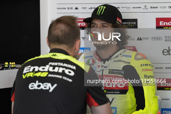 Marco Bezzecchi of Italy and Pertamina Enduro VR46 Racing Team looks on at the box during Free Practice of MotoGP of San Marino at Misano Wo...