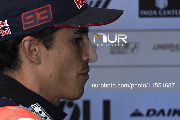 Marc Marquez of Spain and Gresini Racing MotoGP looks on at the box during Free Practice of MotoGP of San Marino at Misano World Circuit in...