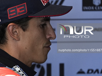 Marc Marquez of Spain and Gresini Racing MotoGP looks on at the box during Free Practice of MotoGP of San Marino at Misano World Circuit in...