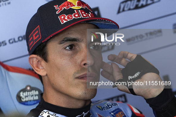 Marc Marquez of Spain and Gresini Racing MotoGP looks on at the box during Free Practice of MotoGP of San Marino at Misano World Circuit in...