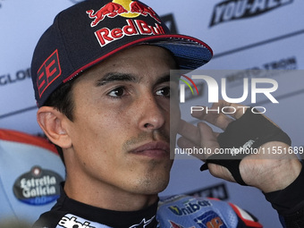 Marc Marquez of Spain and Gresini Racing MotoGP looks on at the box during Free Practice of MotoGP of San Marino at Misano World Circuit in...