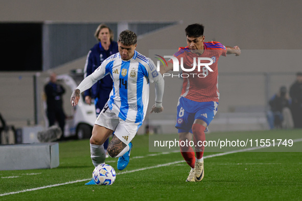 Enzo Fernandez of Argentina and Dario Osorio of Chile are in action during the FIFA World Cup 2026 Qualifier match between Argentina and Chi...