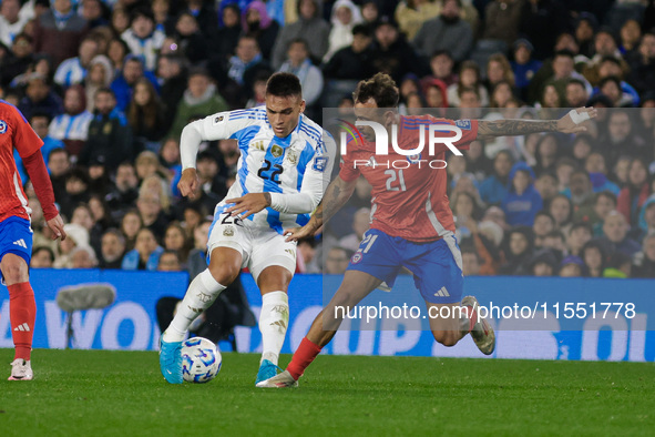 Lautaro Martinez of Argentina and Matias Catalan of Chile are in action during the FIFA World Cup 2026 Qualifier match between Argentina and...