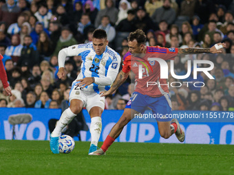 Lautaro Martinez of Argentina and Matias Catalan of Chile are in action during the FIFA World Cup 2026 Qualifier match between Argentina and...