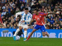 Lautaro Martinez of Argentina and Matias Catalan of Chile are in action during the FIFA World Cup 2026 Qualifier match between Argentina and...