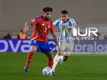 Eugenio Mena of Chile and Nahuel Molina of Argentina are in action during the FIFA World Cup 2026 Qualifier match between Argentina and Chil...