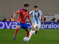 Eugenio Mena of Chile and Nahuel Molina of Argentina are in action during the FIFA World Cup 2026 Qualifier match between Argentina and Chil...