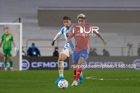 Carlos Palacios of Chile and Enzo Fernandez of Argentina are in action during the FIFA World Cup 2026 Qualifier match between Argentina and...