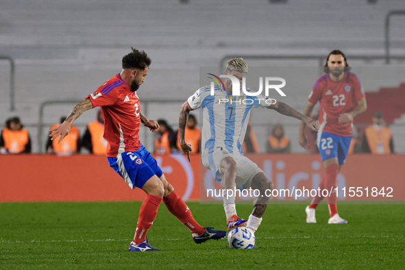 Rodrigo de Paul of Argentina and Matias Catalan of Chile are in action during the FIFA World Cup 2026 Qualifier match between Argentina and...