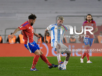 Rodrigo de Paul of Argentina and Matias Catalan of Chile are in action during the FIFA World Cup 2026 Qualifier match between Argentina and...