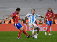 Rodrigo de Paul of Argentina and Matias Catalan of Chile are in action during the FIFA World Cup 2026 Qualifier match between Argentina and...