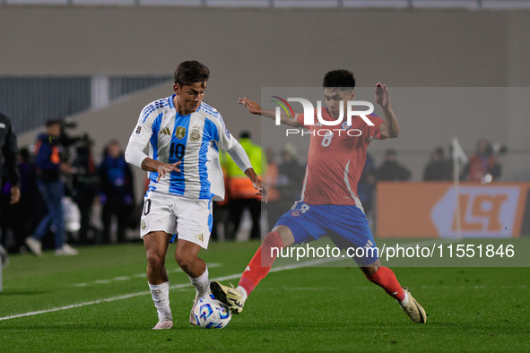 Paulo Dybala of Argentina and Dario Osorio of Chile are in action during the FIFA World Cup 2026 Qualifier match between Argentina and Chile...