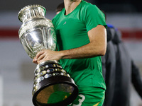 Emiliano Martinez of Argentina celebrates with the Copa America 2024 trophy after the FIFA World Cup 2026 Qualifier match between Argentina...