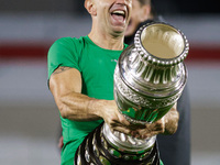 Emiliano Martinez of Argentina celebrates with the Copa America 2024 trophy after the FIFA World Cup 2026 Qualifier match between Argentina...