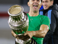 Emiliano Martinez of Argentina celebrates with the Copa America 2024 trophy after the FIFA World Cup 2026 Qualifier match between Argentina...