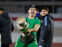 Emiliano Martinez of Argentina celebrates with the Copa America 2024 trophy after the FIFA World Cup 2026 Qualifier match between Argentina...