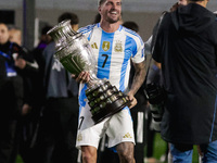 Rodrigo de Paul of Argentina celebrates with the Copa America 2024 trophy after the FIFA World Cup 2026 Qualifier match between Argentina an...