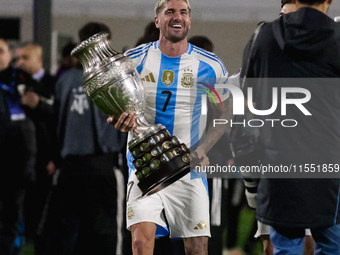 Rodrigo de Paul of Argentina celebrates with the Copa America 2024 trophy after the FIFA World Cup 2026 Qualifier match between Argentina an...