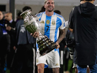 Rodrigo de Paul of Argentina celebrates with the Copa America 2024 trophy after the FIFA World Cup 2026 Qualifier match between Argentina an...