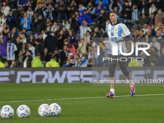 Emiliano Martinez of Argentina warms up before the FIFA World Cup 2026 Qualifier match between Argentina and Chile at Estadio Mas Monumental...