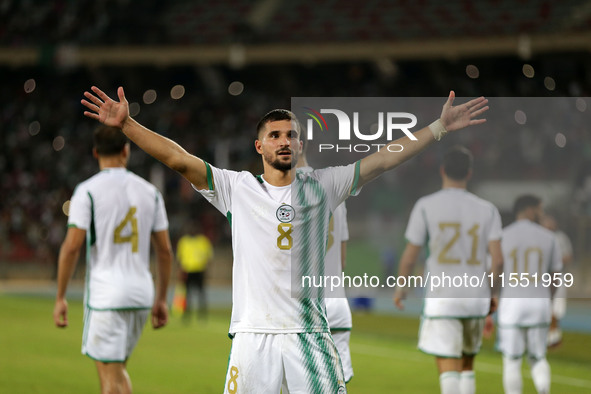 Houssem Eddine Aouar of Algeria celebrates after scoring a goal during the football match for the qualification of the African Cup of Nation...