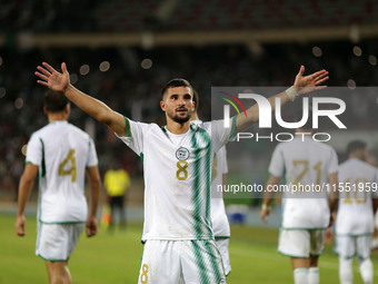 Houssem Eddine Aouar of Algeria celebrates after scoring a goal during the football match for the qualification of the African Cup of Nation...