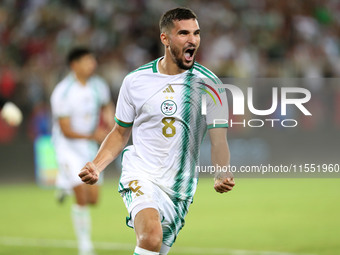 Houssem Eddine Aouar of Algeria celebrates after scoring a goal during the football match for the qualification of the African Cup of Nation...