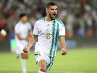 Houssem Eddine Aouar of Algeria celebrates after scoring a goal during the football match for the qualification of the African Cup of Nation...