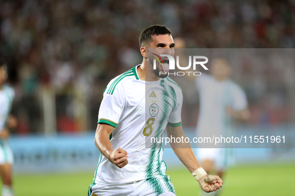 Houssem Eddine Aouar of Algeria celebrates after scoring a goal during the football match for the qualification of the African Cup of Nation...