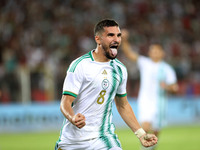 Houssem Eddine Aouar of Algeria celebrates after scoring a goal during the football match for the qualification of the African Cup of Nation...