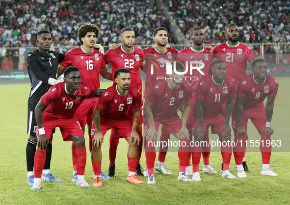 Equatorial Guinea's players pose for a group photo before the African Cup of Nations (AFCON 2025) qualifying football match between Algeria...