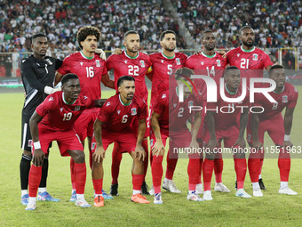 Equatorial Guinea's players pose for a group photo before the African Cup of Nations (AFCON 2025) qualifying football match between Algeria...