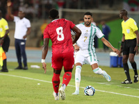 Riyad Karim Mahrez of Algeria competes with Jannick Buyla Sam of Equatorial Guinea during the African Cup of Nations (CAN 2025) qualificatio...