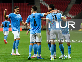 Israeli team members celebrate after scoring during the Belgium vs Israel match on matchday 1 of the UEFA Nations League 2024-2025, in Debre...