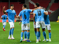 Israeli team members celebrate after scoring during the Belgium vs Israel match on matchday 1 of the UEFA Nations League 2024-2025, in Debre...