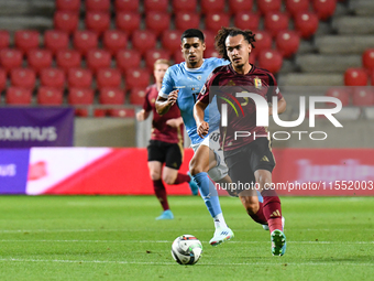 Arthur Theate and Anan Khalaili are in action during Belgium vs. Israel: matchday 1 of UEFA Nations League 2024-2025, in Debrecen, Hungary,...