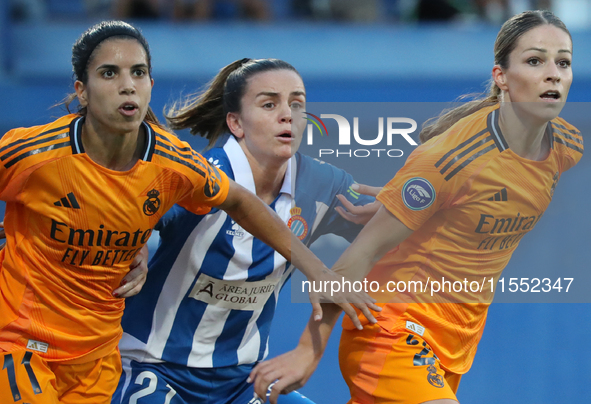 Julia Guerra, Alba Redondo, and Melanie Leupolz play during the match between RCD Espanyol Women and Real Madrid CF Women, corresponding to...