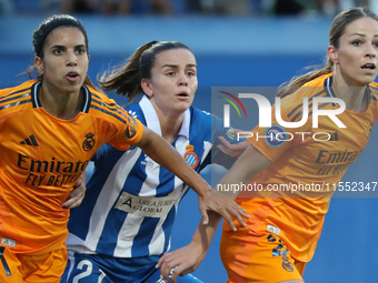 Julia Guerra, Alba Redondo, and Melanie Leupolz play during the match between RCD Espanyol Women and Real Madrid CF Women, corresponding to...