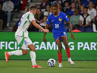 Davide Frattesi (ITA) and Bradley Barcola (FRA) during the UEFA National League Matchday 1 match between France and Italy at the Parc des Pr...