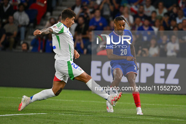 Giovanni Di Lorenzo (ITA) and Bradley Barcola (FRA) during the UEFA National League Matchday 1 match between France and Italy at the Parc de...