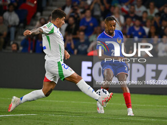 Giovanni Di Lorenzo (ITA) and Bradley Barcola (FRA) during the UEFA National League Matchday 1 match between France and Italy at the Parc de...