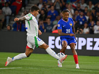 Giovanni Di Lorenzo (ITA) and Bradley Barcola (FRA) during the UEFA National League Matchday 1 match between France and Italy at the Parc de...