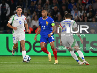 Andrea Cambiaso (ITA) and Kylian Mbappe (FRA) during the UEFA National League Matchday 1 match between France and Italy at the Parc des Prin...