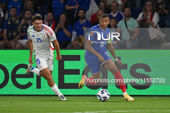 Andrea Cambiaso (ITA) and Kylian Mbappe (FRA) during the UEFA National League Matchday 1 match between France and Italy at the Parc des Prin...