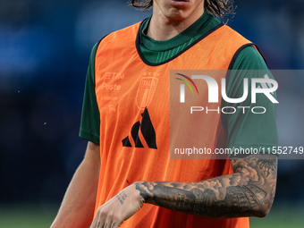 Riccardo Calafiori of Italy warms up before the UEFA Nations League 2024/25 League A Group A2 match between France and Italy at Parc des Pri...